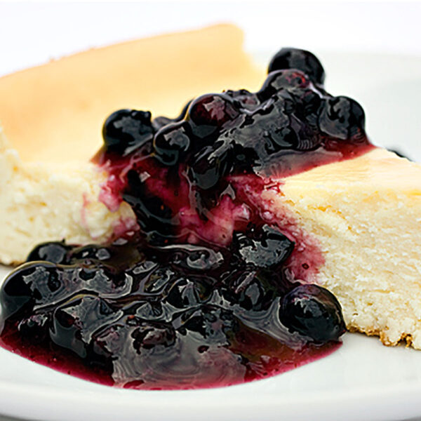 classic cheesecake topped with blueberry sauce