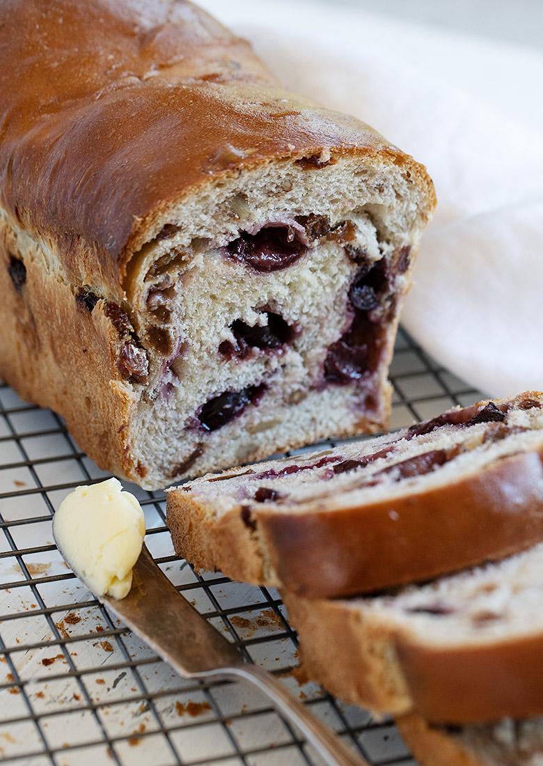 cherry yeast bread sliced on cooling rack