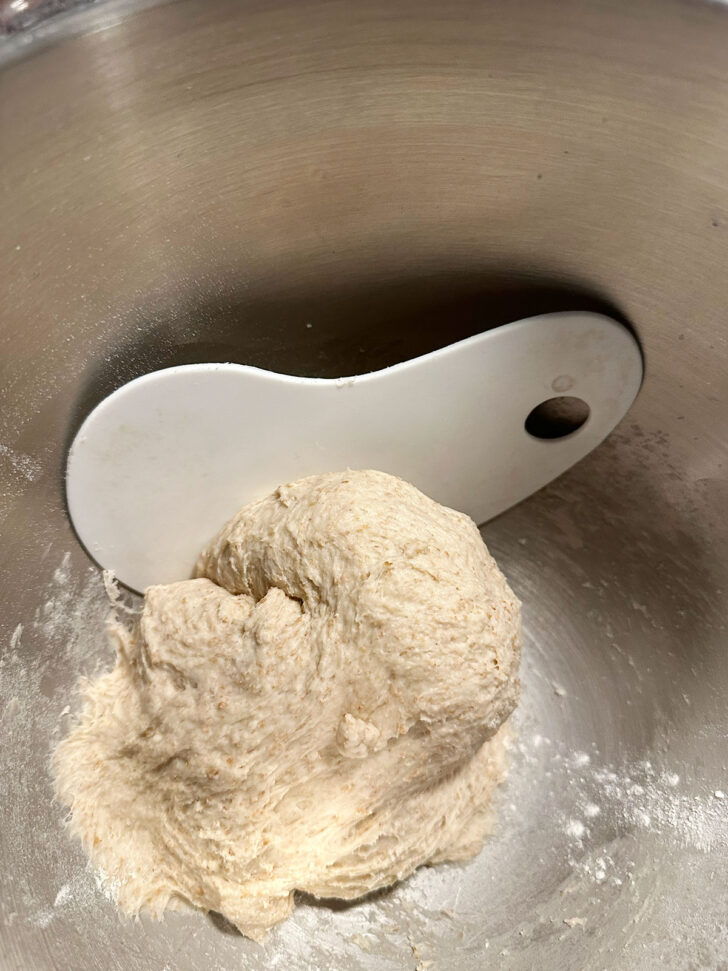 finished dough in bowl with silicone scraper to remove it