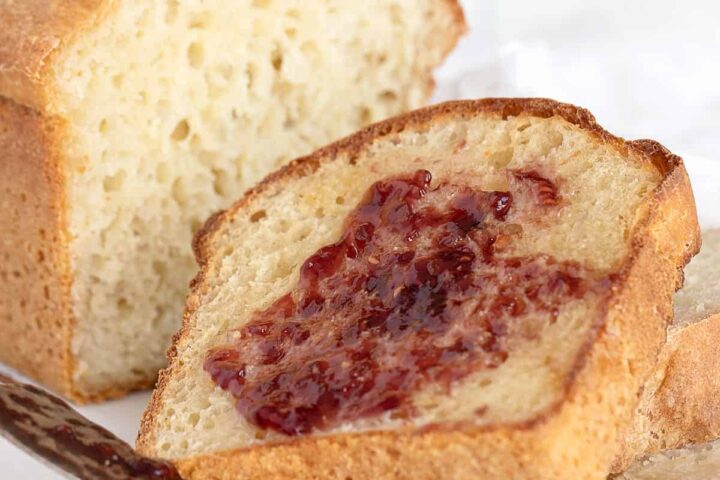 english muffin bread sliced with butter and jam