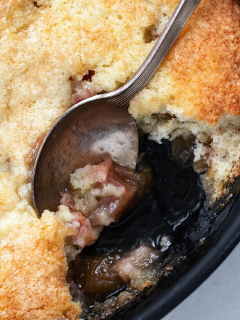 rhubarb cobbler in baking dish with spoon