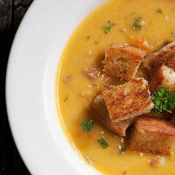 butternut squash chowder in bowl with bacon croutons