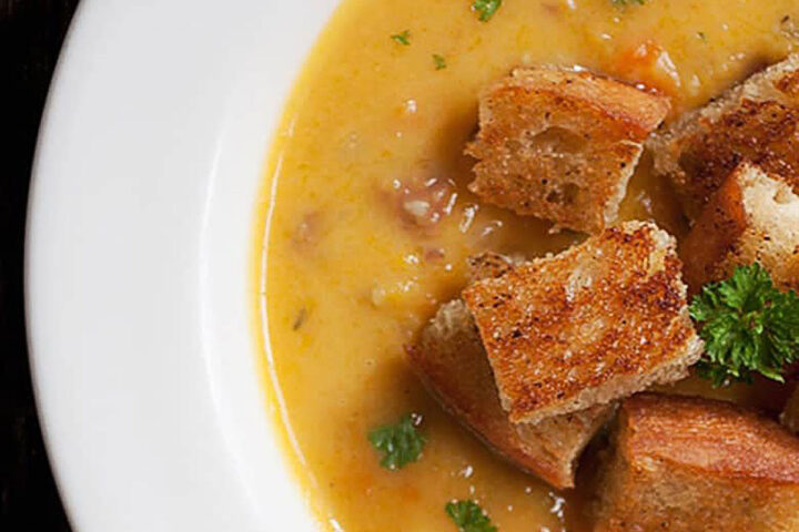 butternut squash chowder in bowl with bacon croutons