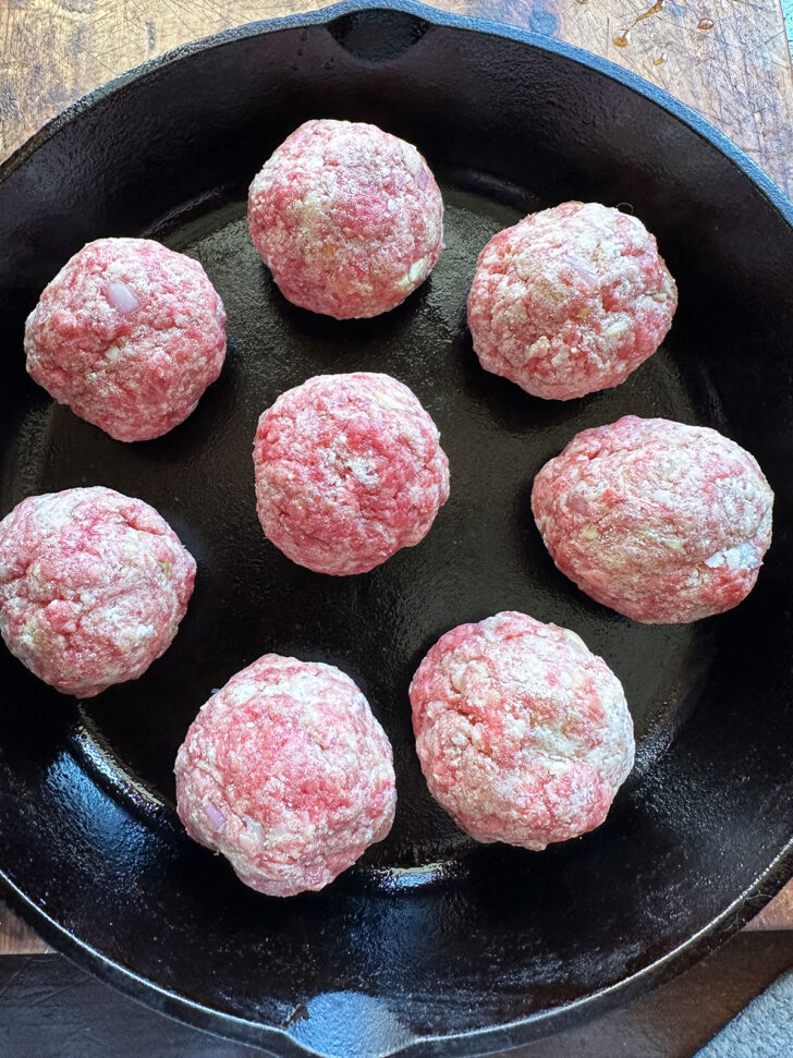 meatballs formed and in skillet before baking