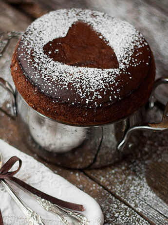chocolate souffle in baking dish with spoons
