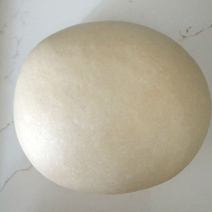 Kneaded dough ball on the counter.