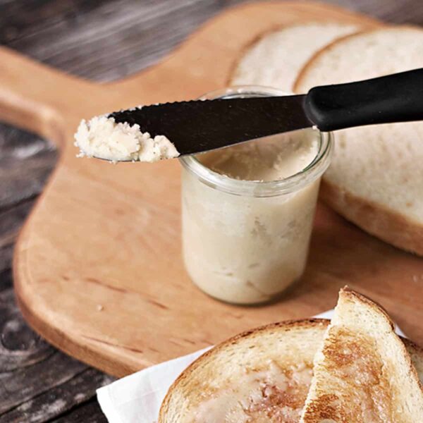 maple butter and bread on cutting board with toast