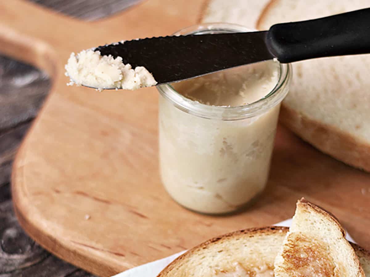 maple butter and bread on cutting board with toast