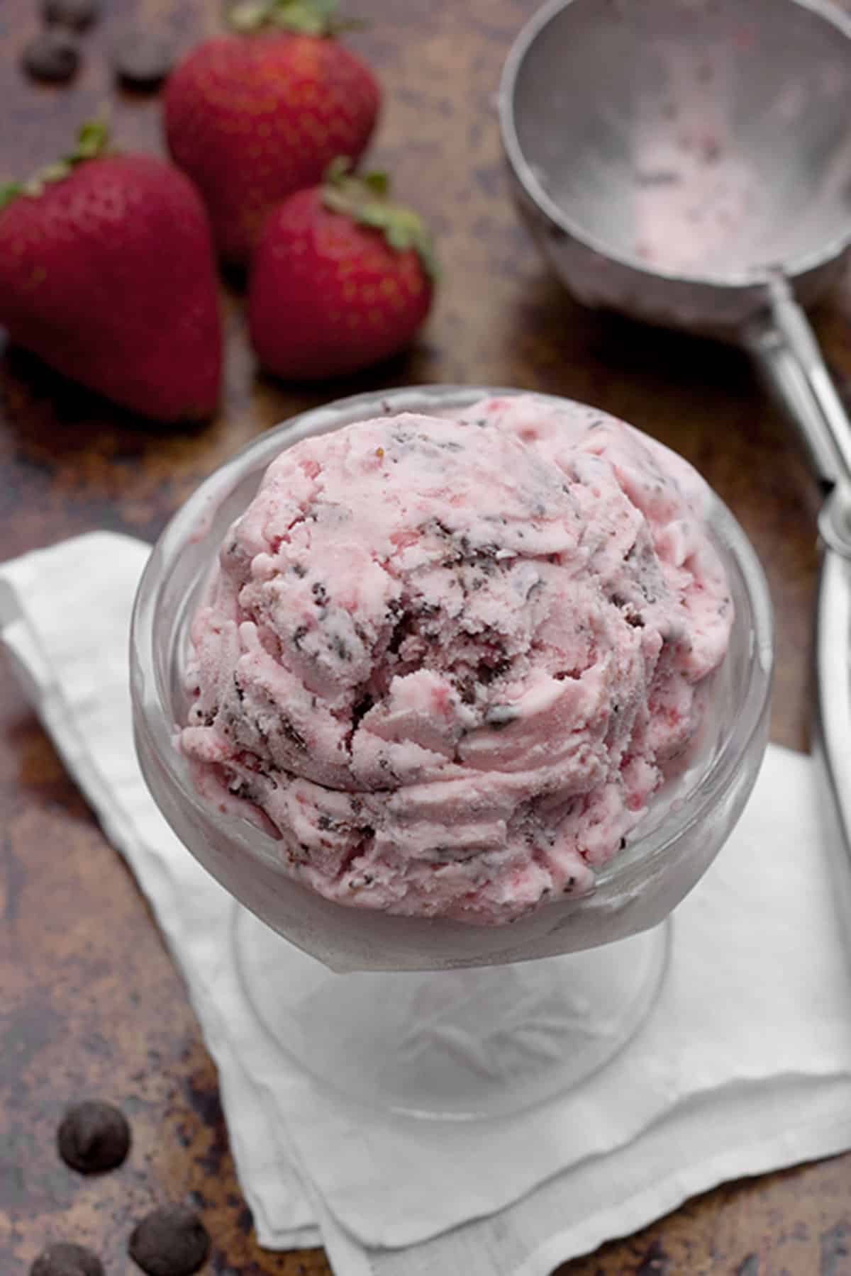 chocolate covered strawberry ice cream in ice cream bowl with scoop