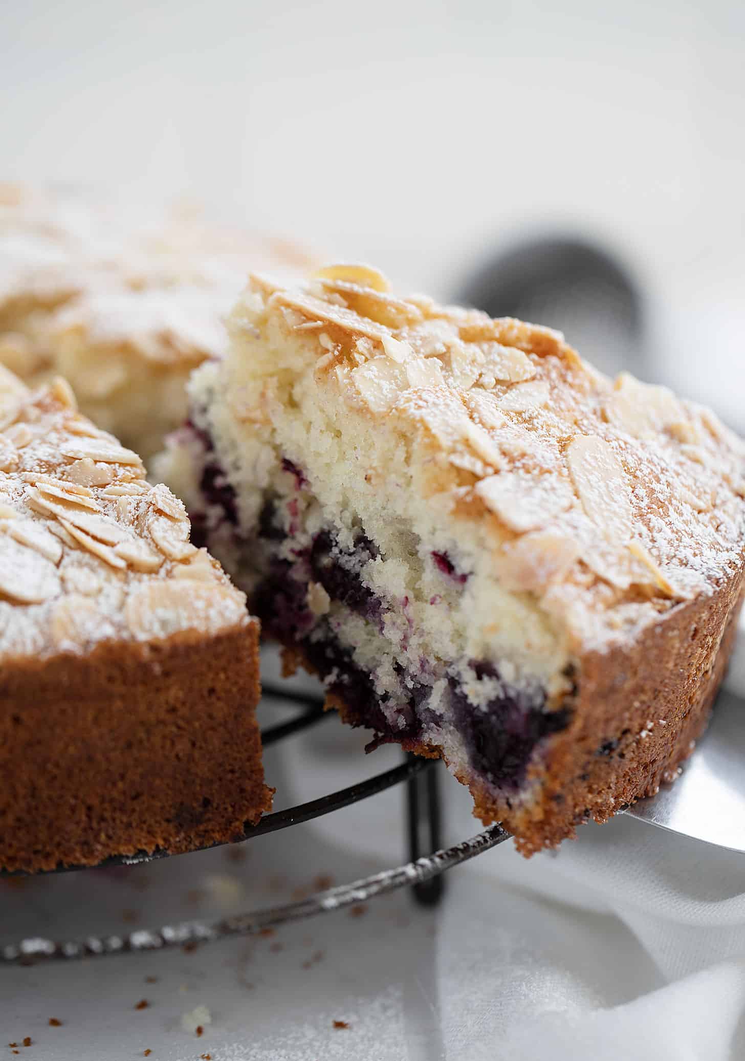 blueberry muffin cake sliced on cooling rack