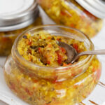 zucchini mustard relish in jars with spoon