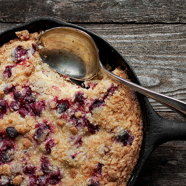 cranberry breakfast cake baked in a cast iron skillet