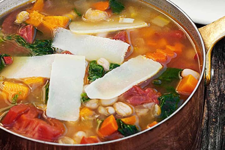harvest vegetable soup in copper saucepan