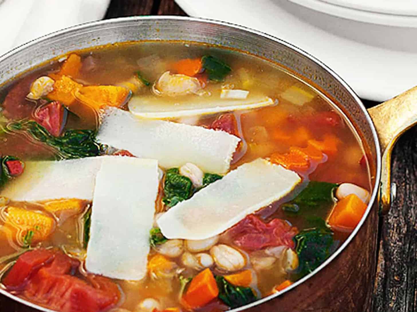 harvest vegetable soup in copper pot