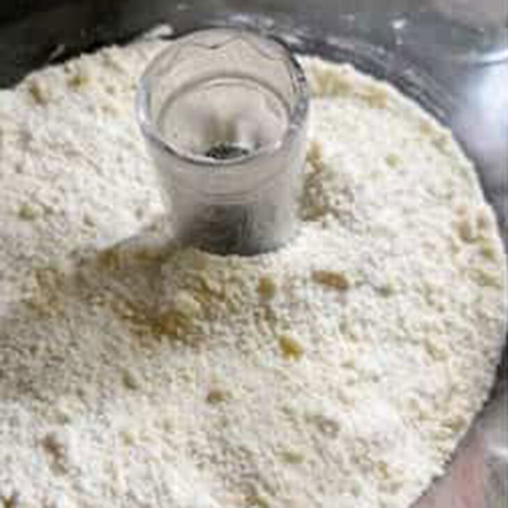 Flour and butter mixture processed in a food processor.