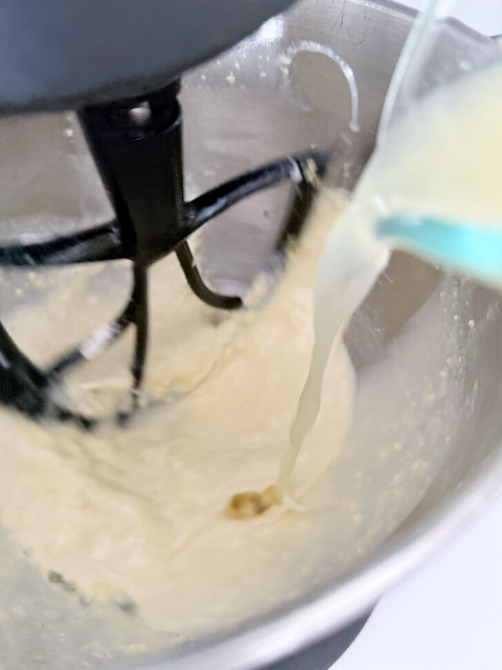 Adding lemon juice to the batter.