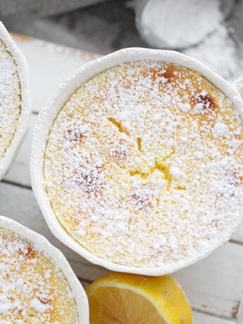 Lemon pudding cakes on a serving stand.