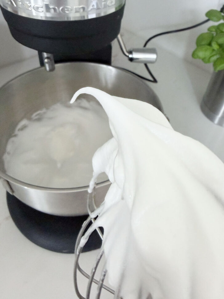 Egg whites mixed to stiff peaks.