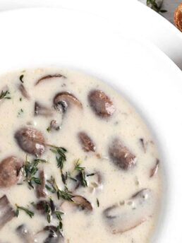 mushroom soup in white bowl with bread