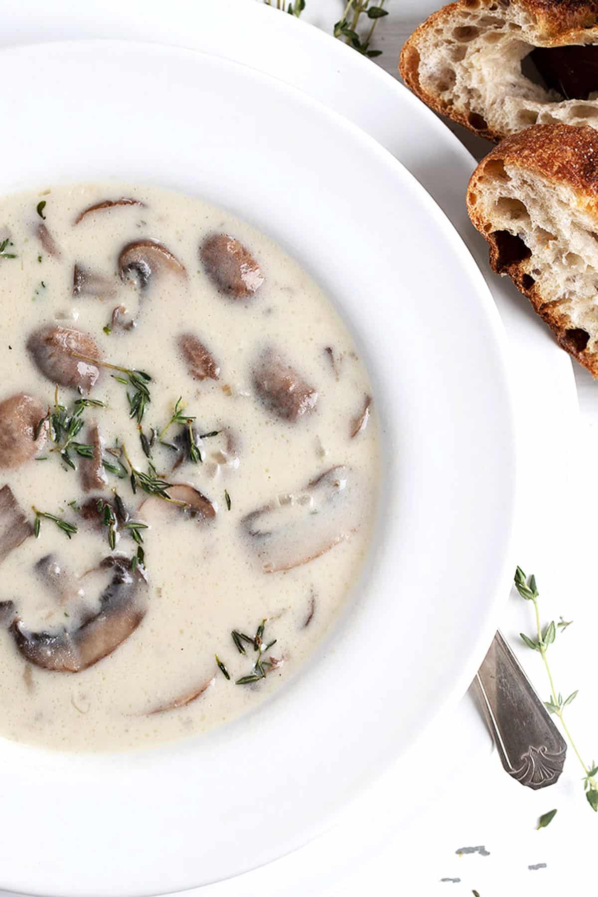 mushroom soup in white bowl with bread