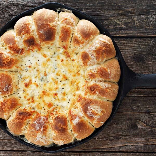 skillet bread and artichoke dip in cast iron skillet