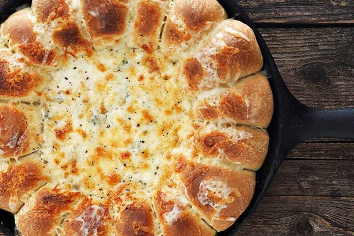 skillet bread and artichoke dip in cast iron skillet