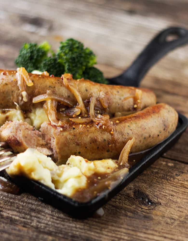 bangers and mash with onion gravy on small skillet