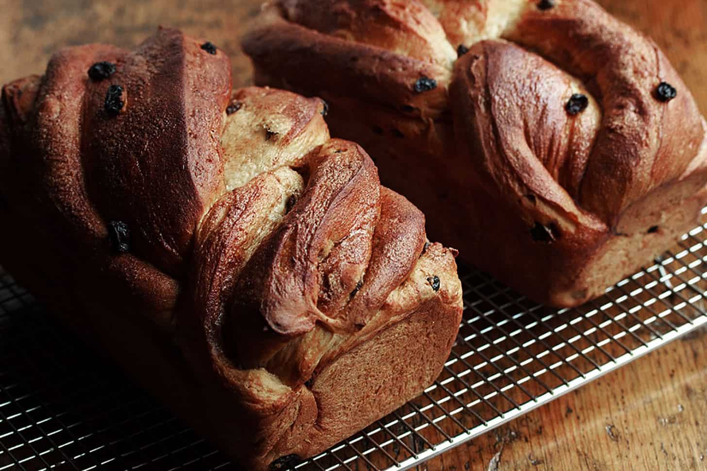 twisted cinnamon raisin bread on cooling rack