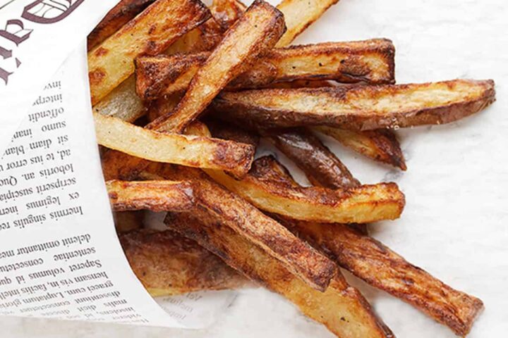 perfect air fryer fries wrapped in newspaper wrap