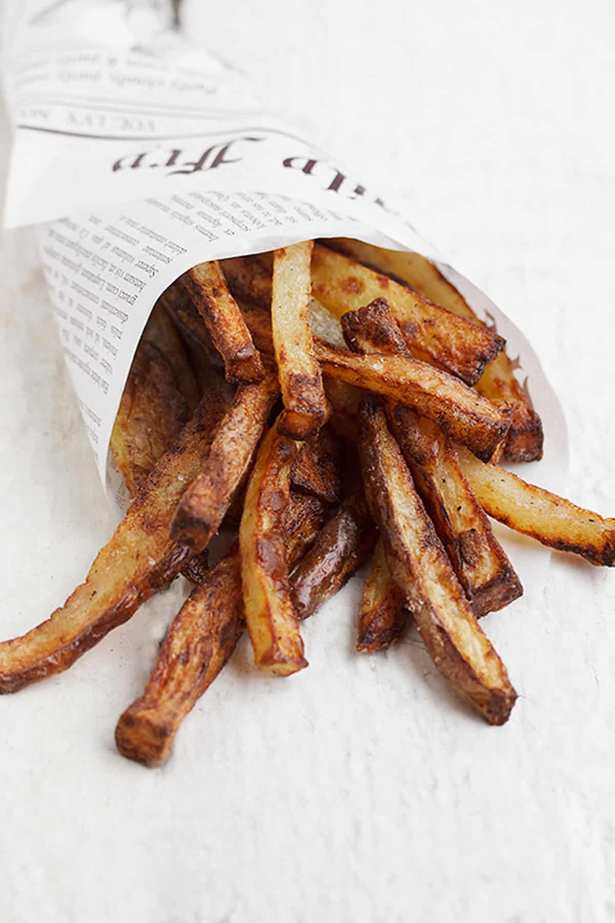 perfect air fryer fries wrapped in newspaper wrap