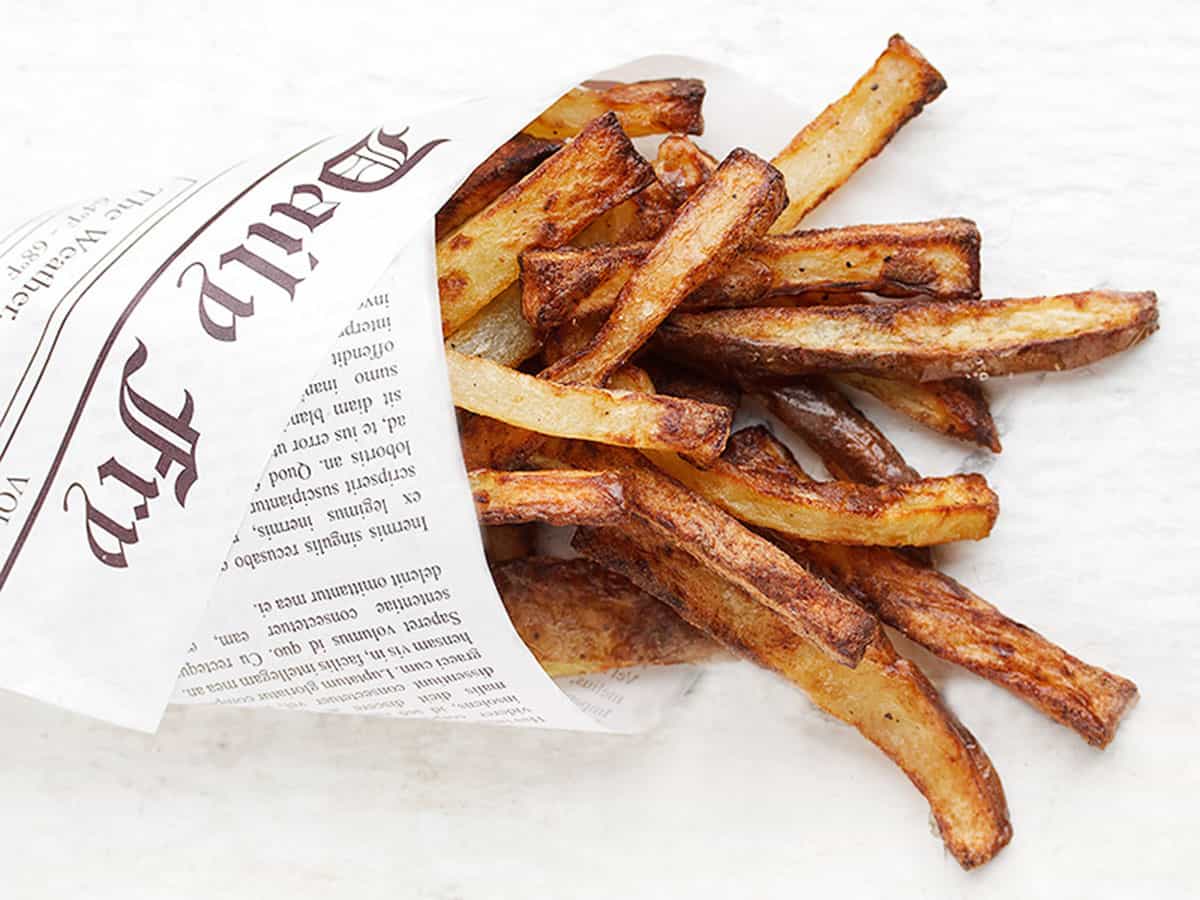 perfect air fryer fries wrapped in newspaper wrap