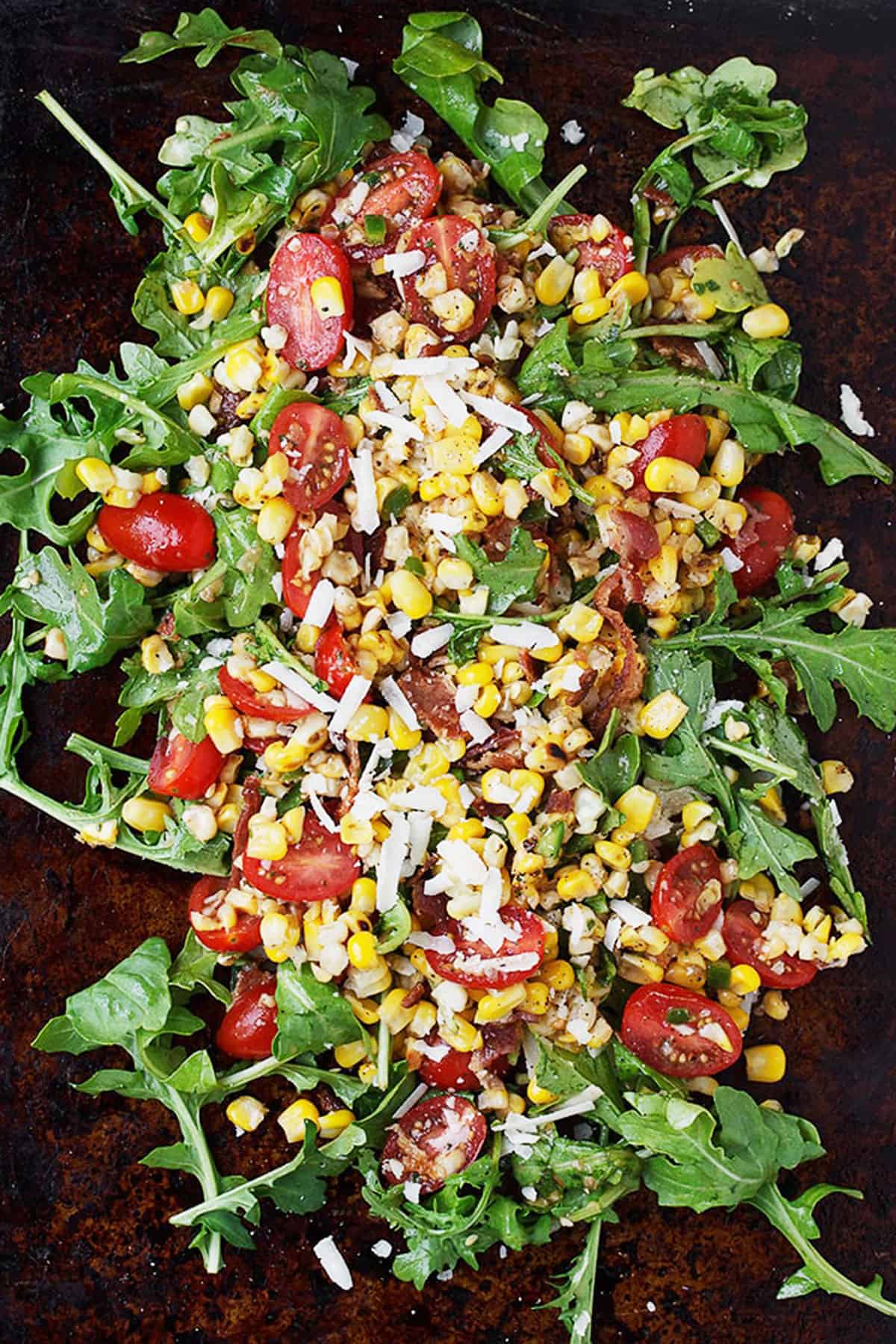 grilled corn salad with tomatoes and arugula