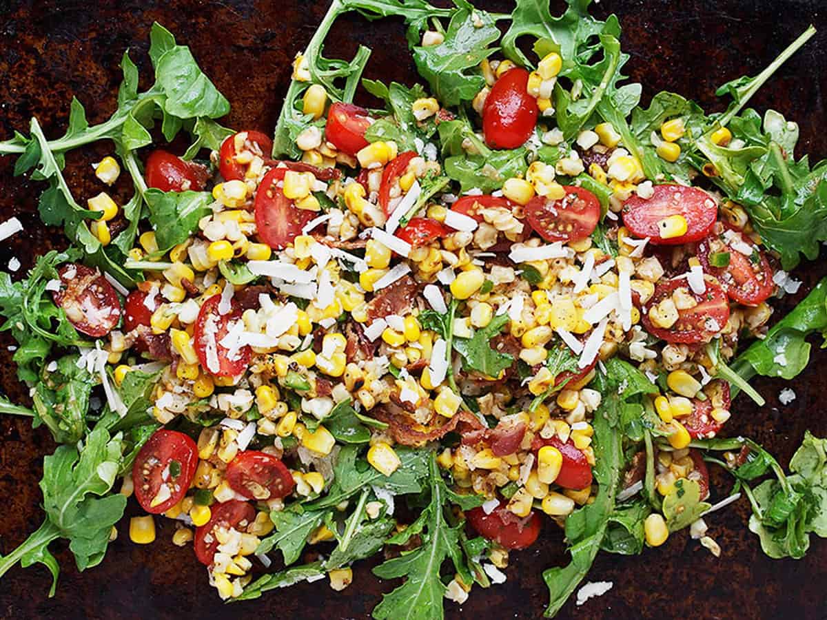 grilled corn salad with tomatoes and arugula