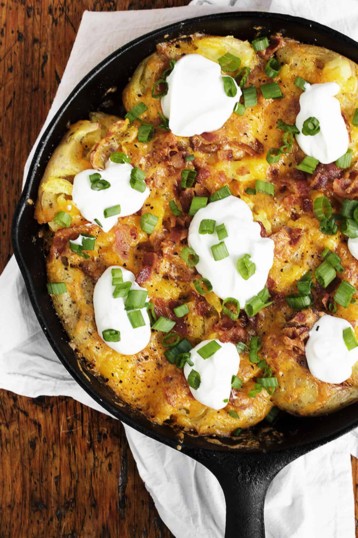 loaded smashed potato skillet in cast iron skillet