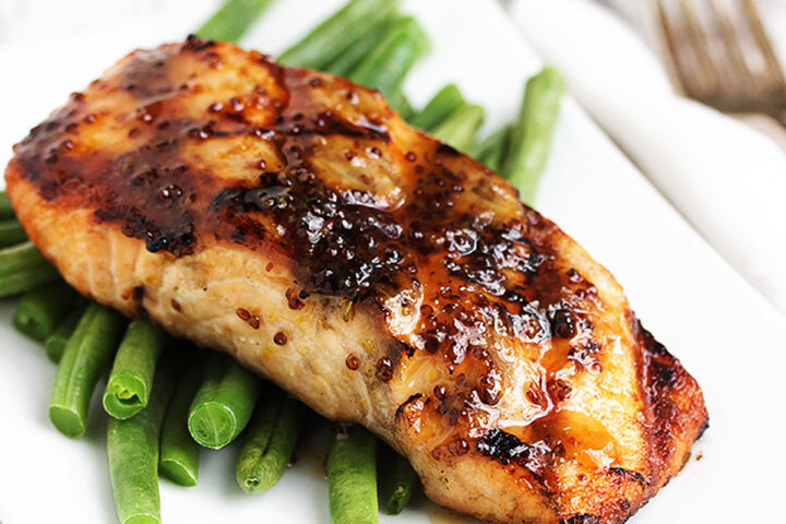 grilled maple mustard salmon on plate with green beans