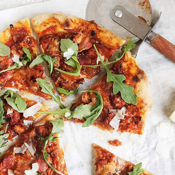 manchego chorizo pizza sliced on parchment