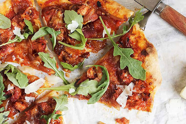 manchego chorizo pizza sliced on parchment