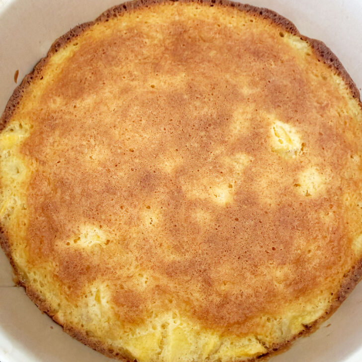 Peaches and cream cake in the baking pan after baking.