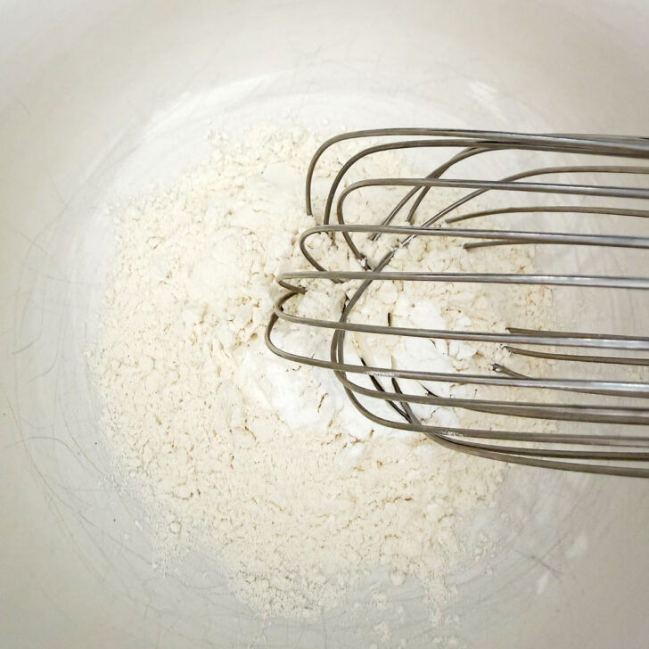Whisking the dry ingredients in a small bowl.
