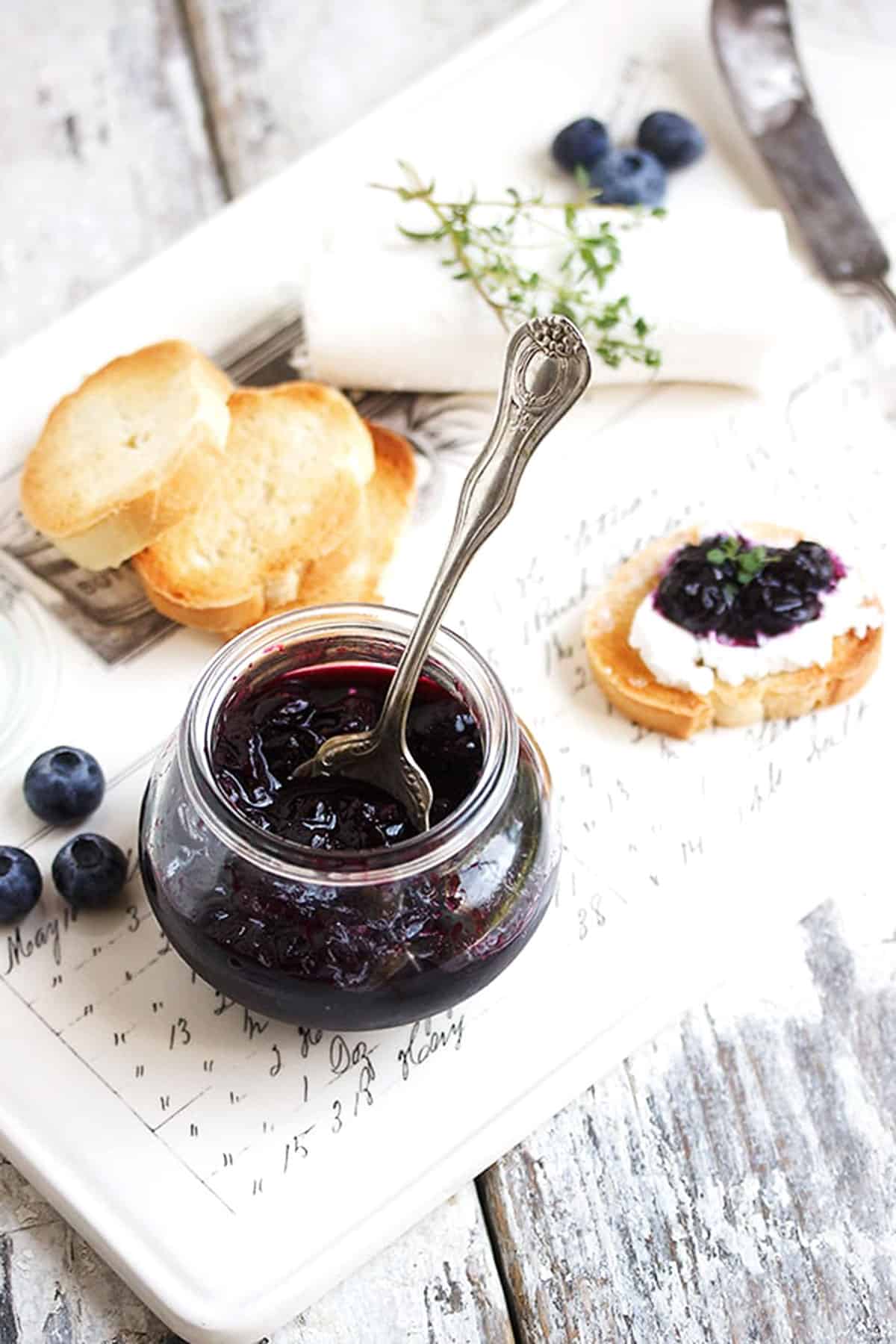 quick pickled blueberries in jar with crostini