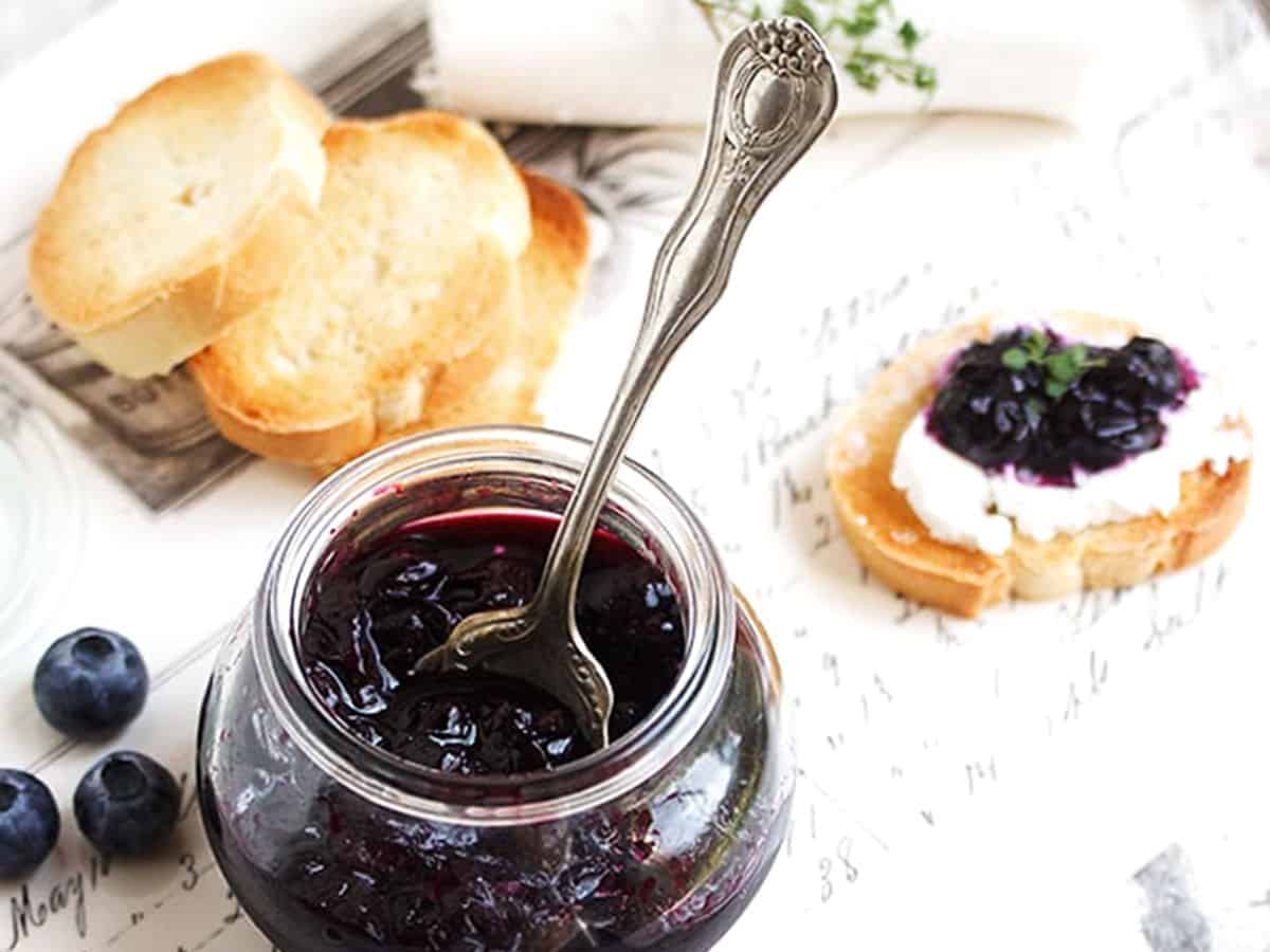 quick pickled blueberries in jar with crostini