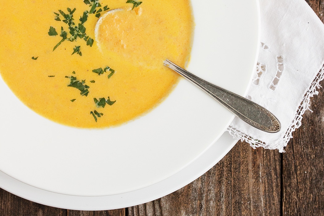 carrot soup in white bowl