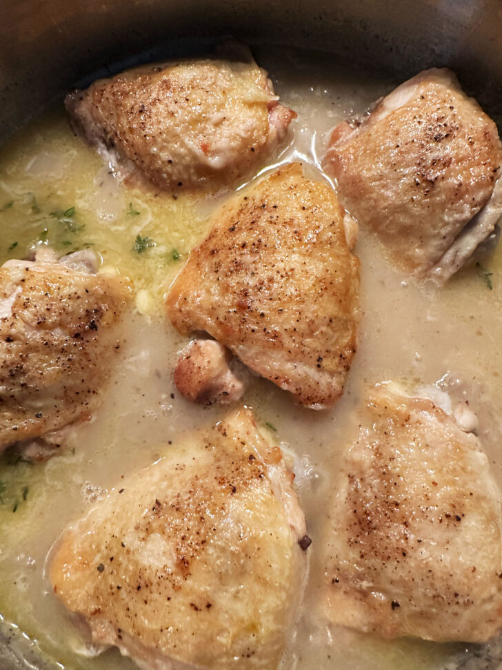 Simmering the chicken with the gravy.