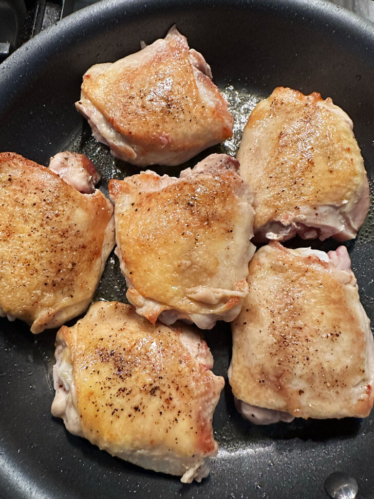 Chicken thighs after flipping.