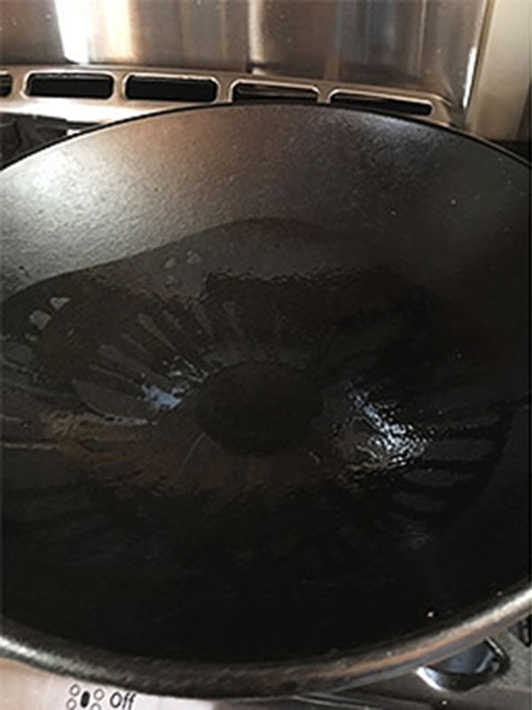 Oil added to a hot wok.