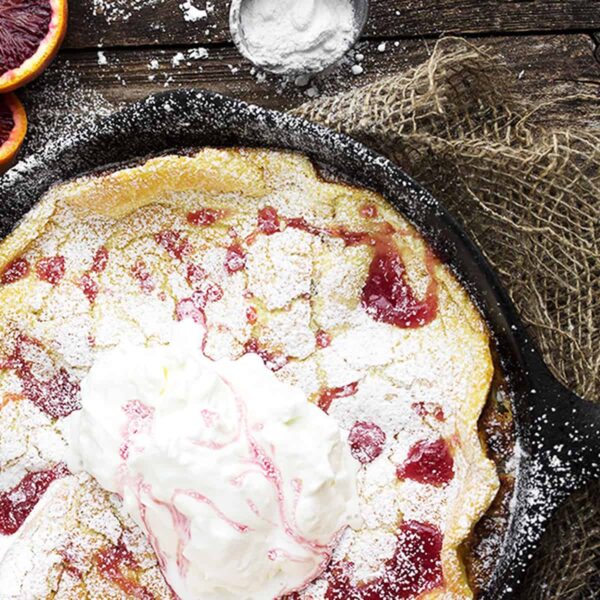 Dutch baby with blood orange syrup on top
