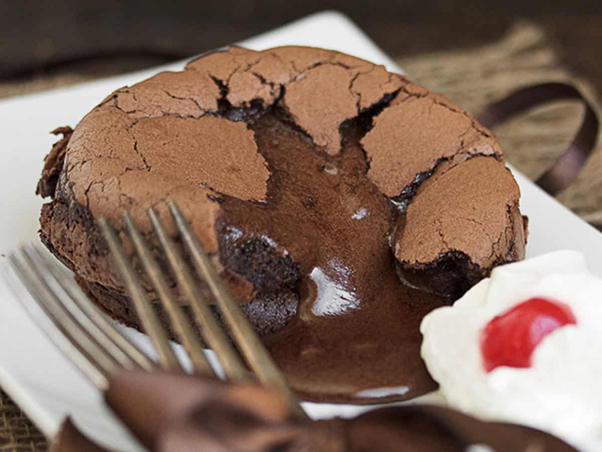 melting molten chocolate cake cut open on plate