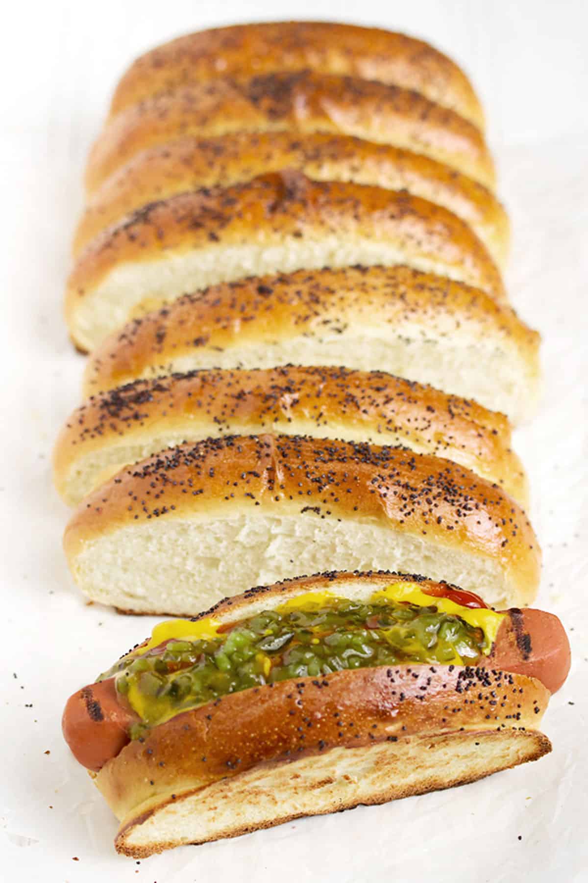 top sliced hot dog buns on white background