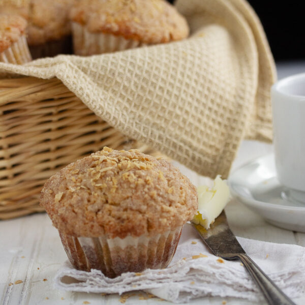 maple muffins in basket with one out