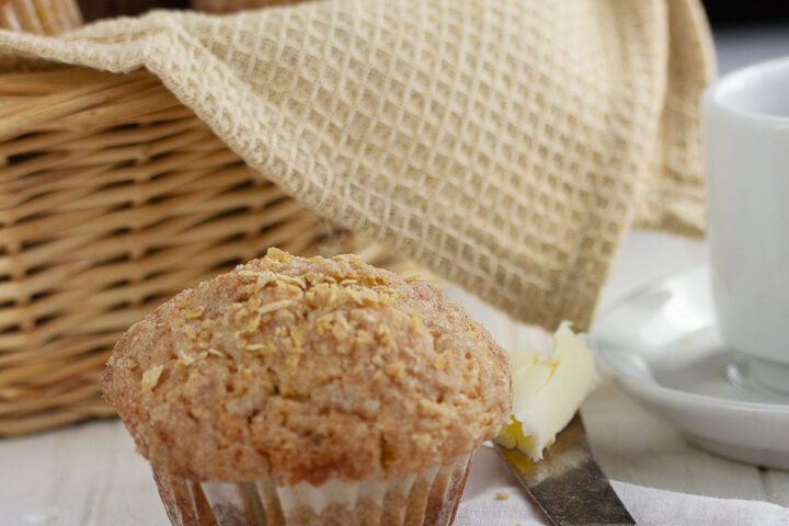 maple muffins in basket with one out